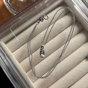 10k gold pendant with very pale blue stone